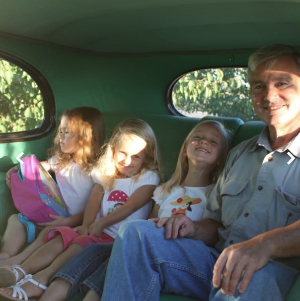 Dr. Packard inside the car with his granddaughters Creekside Dental