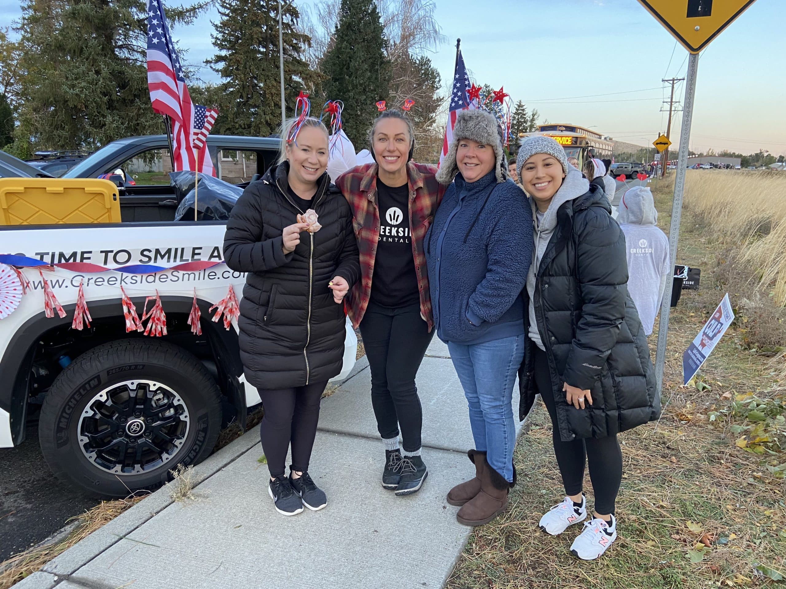 Creekside Dental team posing for the camera at the Veterans Day Parade