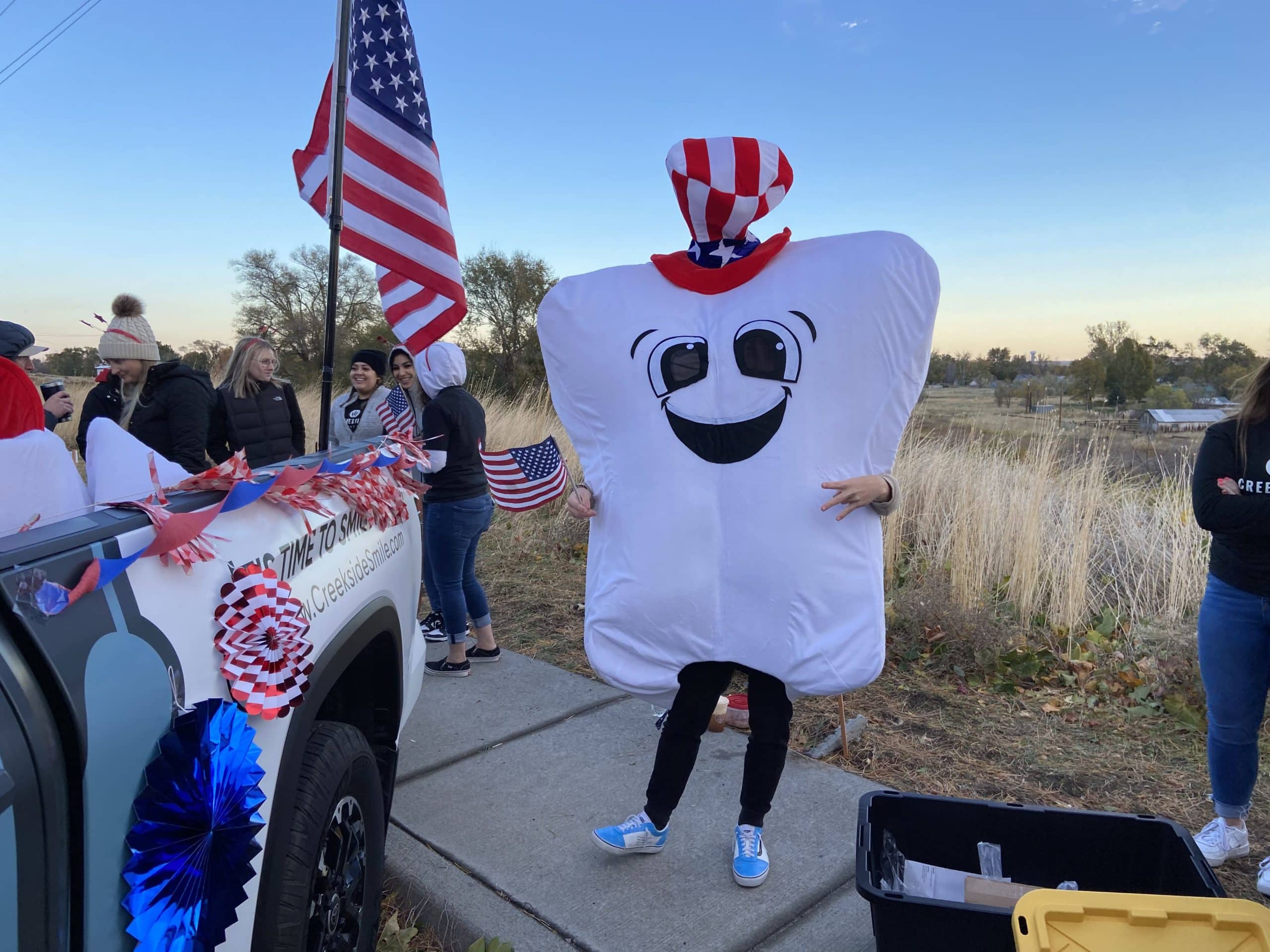 a tooth mascot for the Veterans Day Parade Creekside Dental