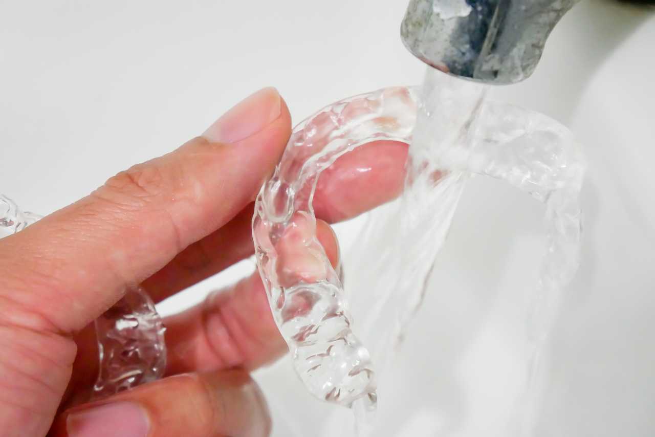 rinsing your invisalign aligners with water Creekside Dental