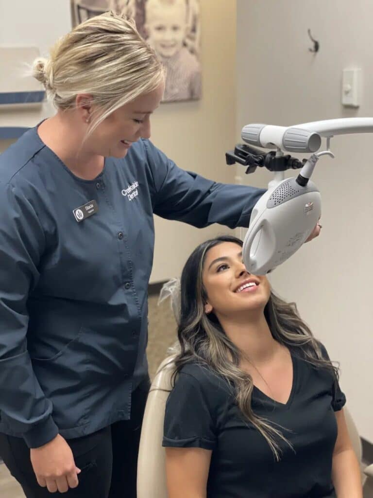 patient doing the zoom whitening procedure Creekside Dental