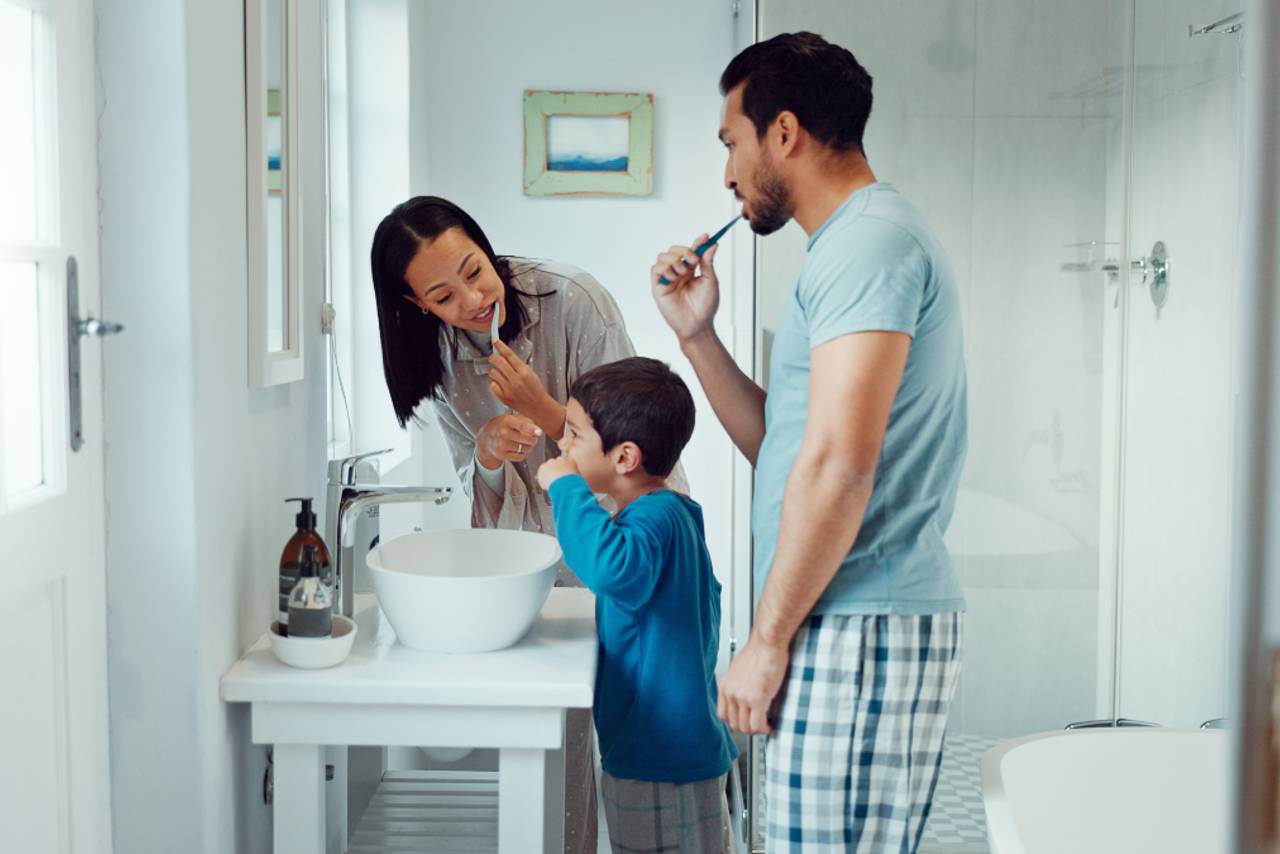 family brushes teeth together dental care tips from Creekside Dental